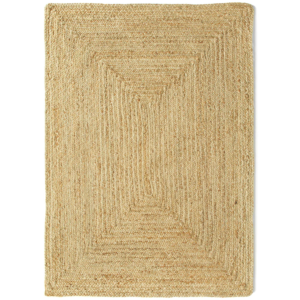 A rectangular, plant-based rug featuring a textured, geometric pattern and a light tan colour, crafted from natural fibres for an eco-friendly touch.