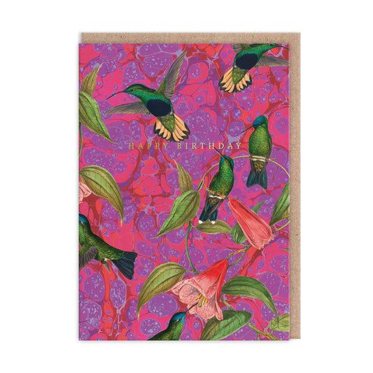 Birthday card featuring a kaleidoscopic masterpiece of colourful hummingbirds, flowers, and green leaves on a pink patterned background. Brown envelope included.