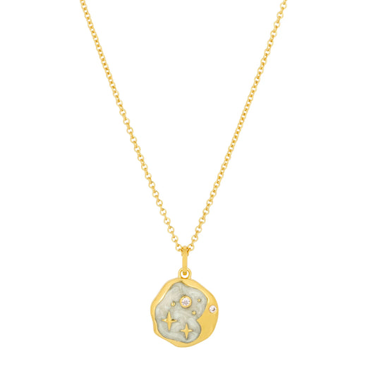 Gold chain necklace with a round, textured pendant adorned with tiny embedded crystals and engraved star motifs—an elegant piece of celestial jewellery reminiscent of a Starry Night Gold Necklace.