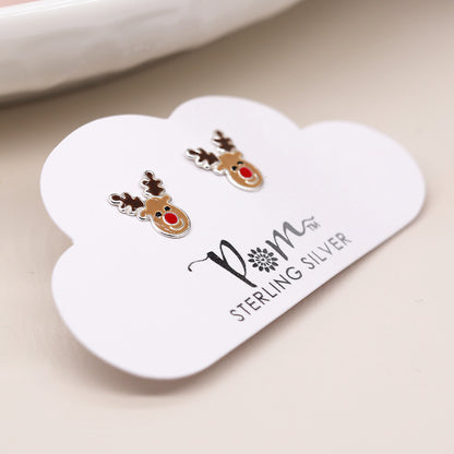 A pair of sterling silver reindeer earrings with red noses, displayed on a cloud-shaped card labelled POM STERLING SILVER—the ideal festive jewellery for the holiday season.