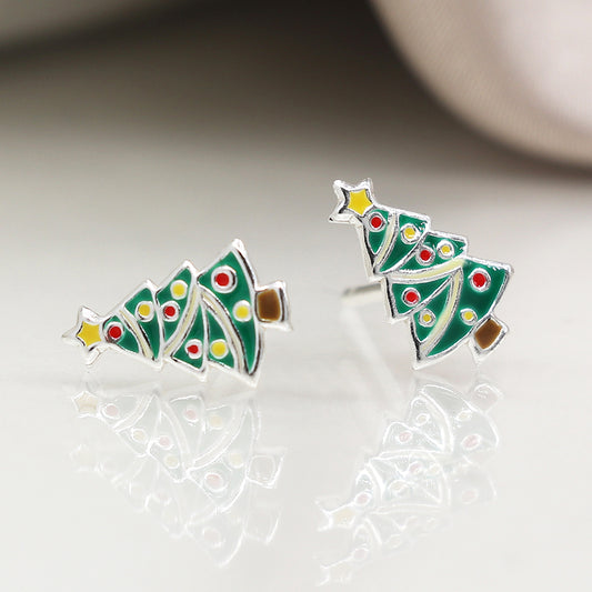 A pair of sterling silver Christmas tree earrings shaped like decorated trees with green enamel, colourful dots, a yellow star, and brown base—the perfect festive earrings for lovers of holiday jewellery.