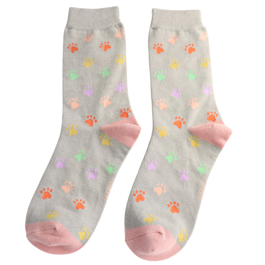 A pair of mid-grey socks featuring multicoloured paw print patterns with pink toes and heels, crafted from a bamboo-rich blend, laid flat on a white background.