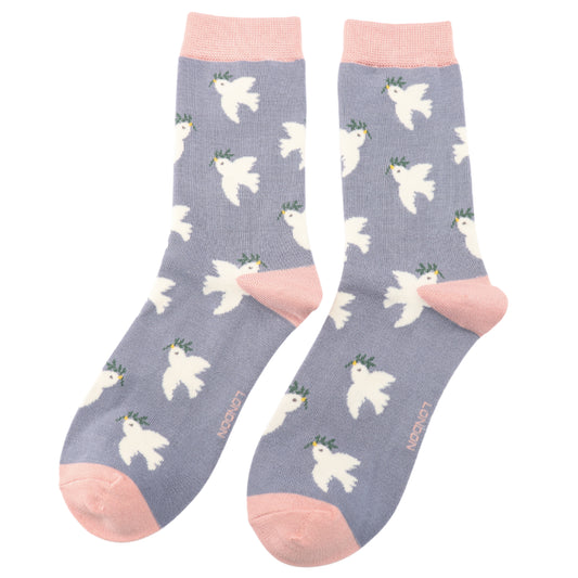 A pair of light purple Doves Denim Socks with pink toes, heels, and cuffs, featuring a pattern of white doves with green leaves. Made from bamboo and cotton, they fit UK sizes 3–7.