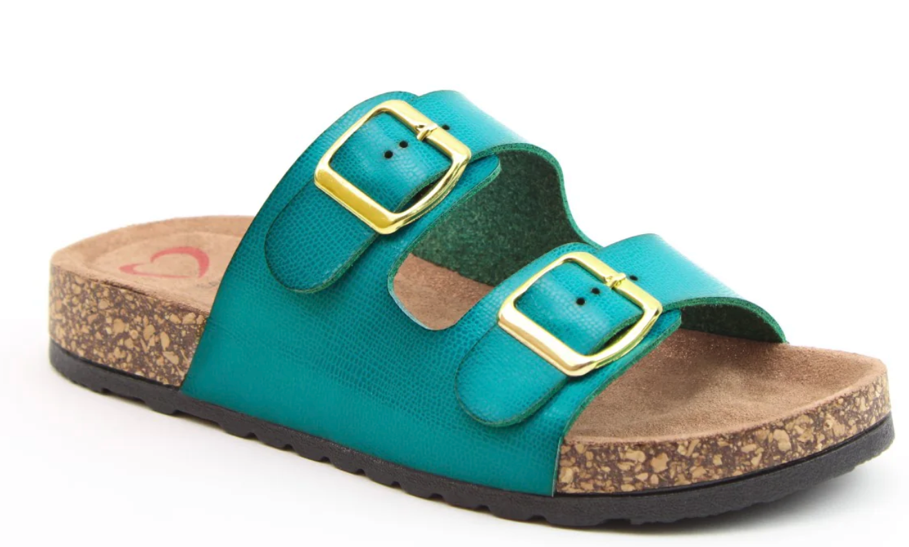 A turquoise vegan sandal featuring two gold buckles and a cork-patterned sole, ideal as premium summer footwear, shown against a white background.