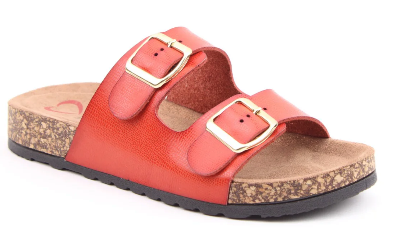A red slip-on summer sandal with two adjustable gold buckles, a cork footbed, and a black rubber sole.