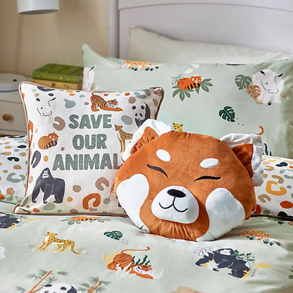 Decorative cushions on a bed, including a wildlife cushion with ‘Save Our Animals’ text and animal illustrations, alongside an orange animal face cushion and coordinating animal-themed bedding.