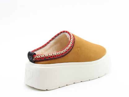 Discover the Franca Suedette Litesoles Slides: a tan slip-on shoe with a white platform sole and red stitched trim. Part of our Vegan-Friendly Range, it features a comfortable lined interior and a black logo pull tab at the back.