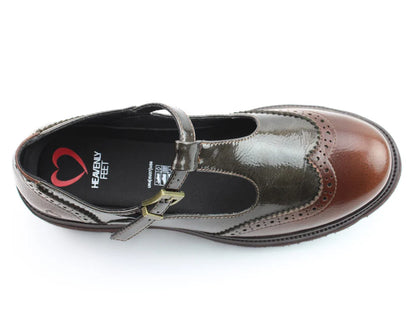 A single brown and dark grey Mary Jane shoe with a buckle strap, chunky sole, and brogue detailing is seen from above against a white background.