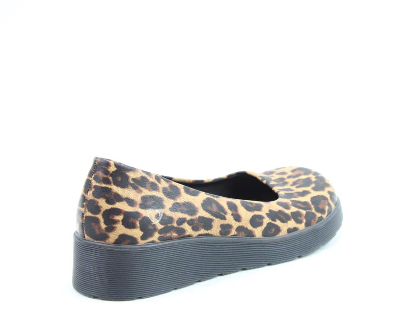 A single leopard-print flat shoe with a thick black wedge sole and memory-foam insole, photographed against a white background.