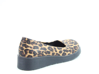 A single leopard-print flat shoe with a thick black wedge sole and memory-foam insole, photographed against a white background.