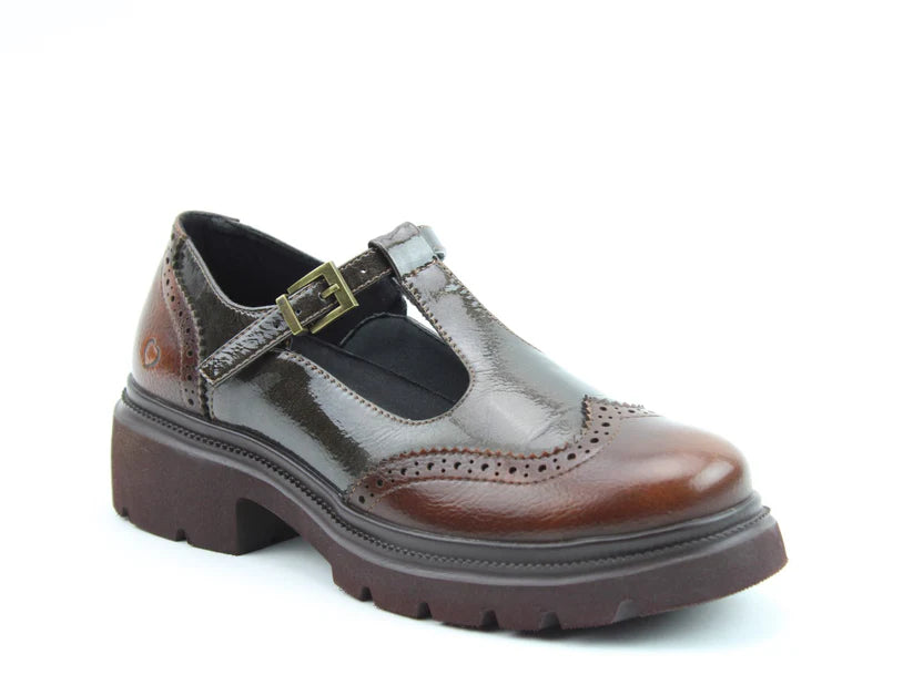 A single brown vegan T-bar brogue with a chunky sole, brogue detailing, and a metal buckle, featuring memory-foam insoles, photographed against a white background.