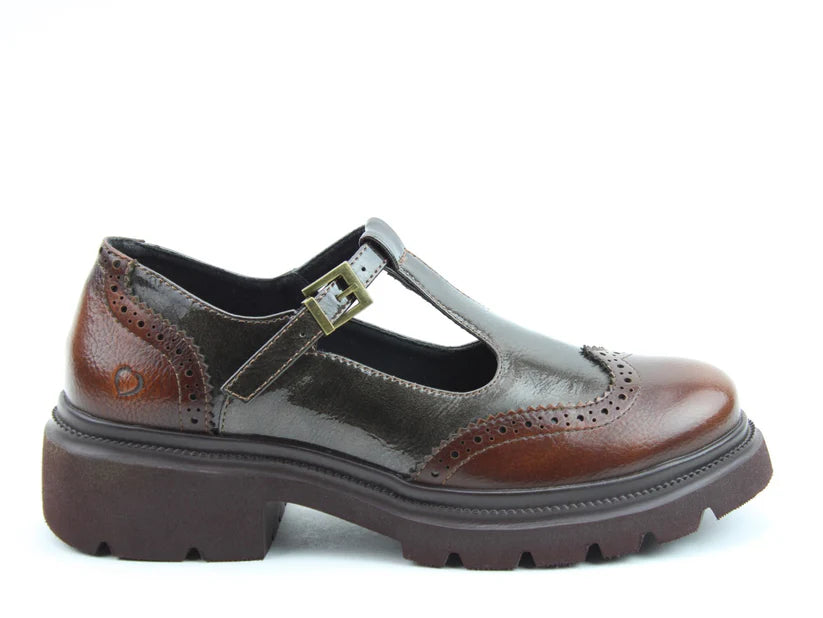 Brown leather Mary Jane shoe with brogue detailing, a buckle strap, and chunky sole, featuring memory-foam insoles for all-day comfort. Displayed in profile on a white background.