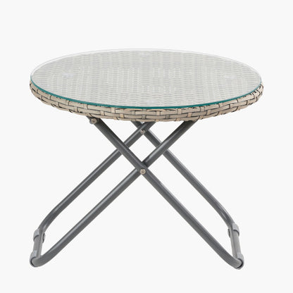 Round folding table with a wicker edge, glass top, and metal legs—ideal for pairing with rattan chairs as part of your garden furniture set. Shown against a plain white background.