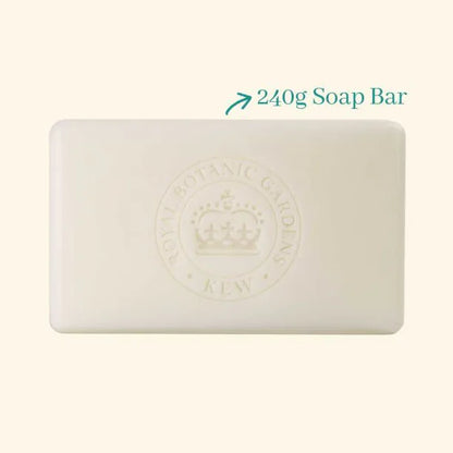 A rectangular white Kew Gardens Geranium and Basil Soap bar featuring an embossed crown logo and Royal Botanic Gardens, Kew lettering, marked as a 240g vegan-friendly soap.
