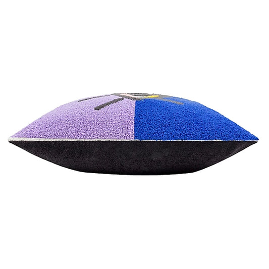 A square Bouclé cushion with a textured surface, featuring purple and blue panels on the top and a solid black base, seen from the side.