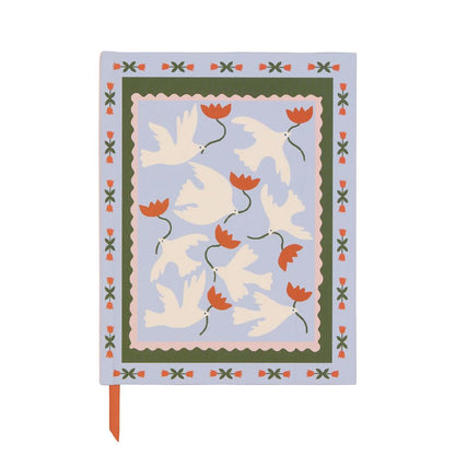 A Dopo Journal: a pastel blue floral notebook featuring white birds, red flowers, a decorative border, and an orange ribbon bookmark.