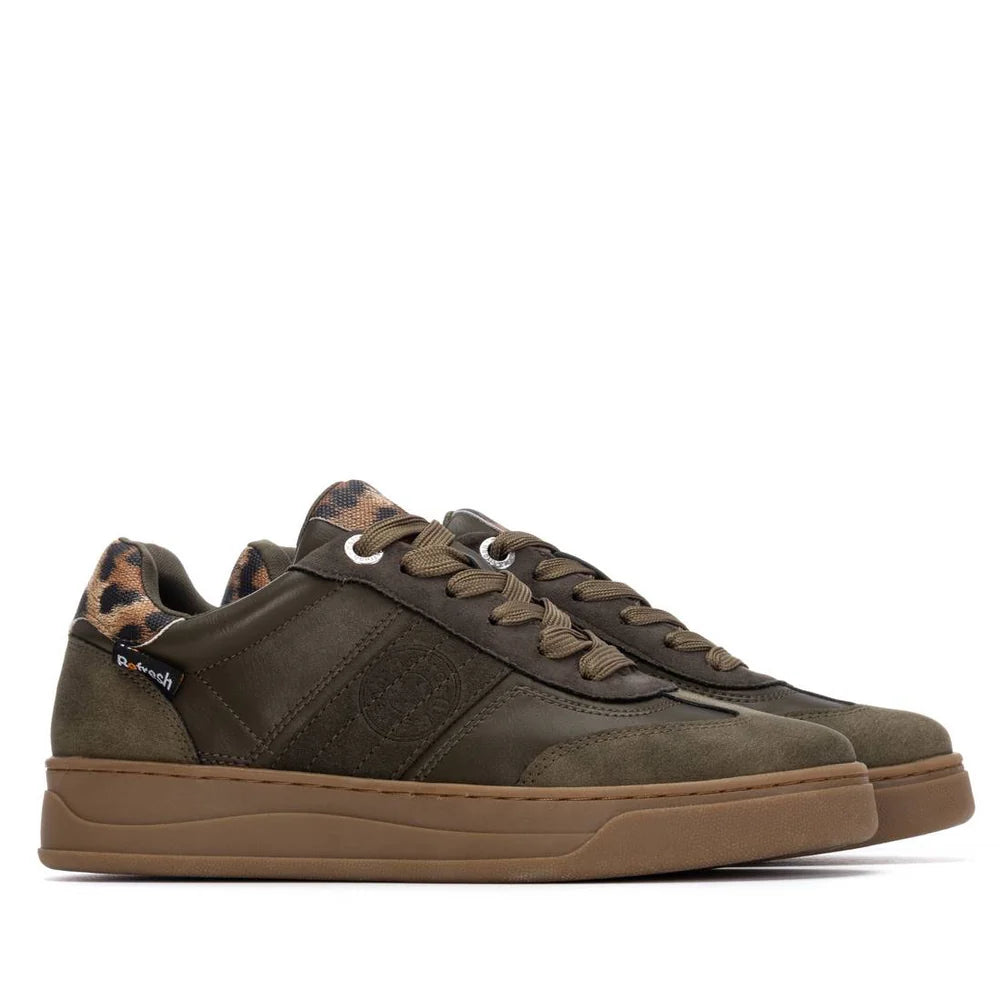 A pair of olive green vegan trainers featuring brown non-slip rubber soles, leopard print detailing on the heel and tongue, and dark green laces.