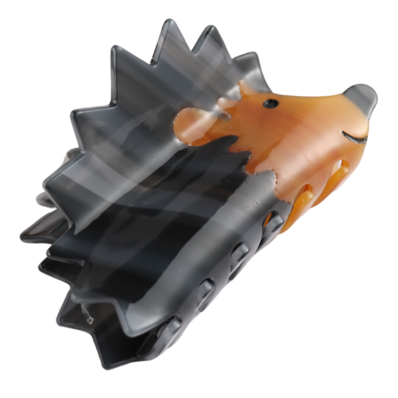 Luxurious Hedgehog Hair Claw Clip featuring a brown and black design, strong grip, and a smiling face.