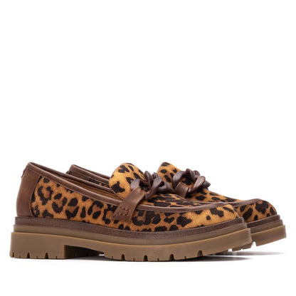 Brown loafers with chunky soles and leopard-print uppers made from faux leather, featuring decorative knotted detailing—ideal women’s moccasins for making a bold statement.