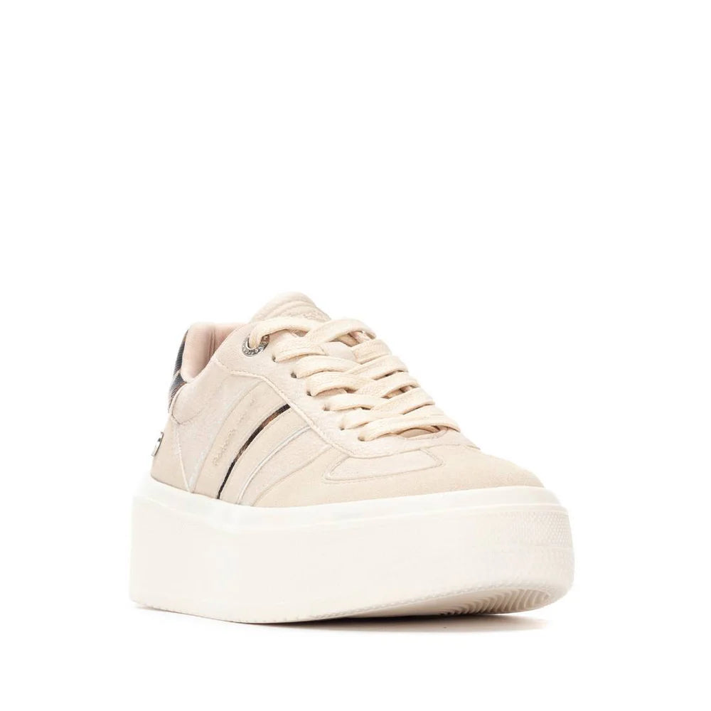 A beige platform trainer with white laces, subtle stripe detailing, and a thick non-slip rubber sole; these PETA-certified vegan trainers are displayed against a white background.