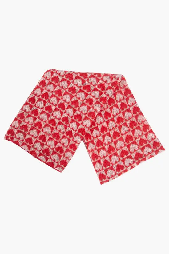Red and white cruelty-free scarf showcasing a repeating pattern of heart shapes—ideal for those seeking a vegan winter scarf with cosy style.