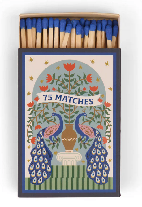 An open box of 75 safety matches with blue tips, featuring an illustrated design of two peacocks and a vase of flowers—ideal for lighting your favourite A Dopo candle.