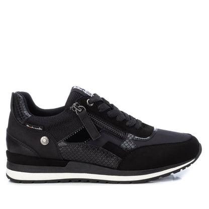 Black athletic trainer with laces, side zip, textured panels, white-accented sole, and a removable insole—these women’s vegan trainers are PETA-certified. Shown side-on against a white background.