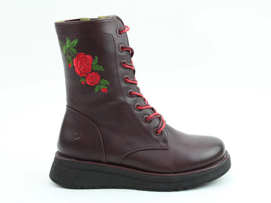 A maroon lace-up boot with a black sole and red rose embroidery on the side; these embroidered rose boots feature a comfortable memory foam insole, pictured against a white background.