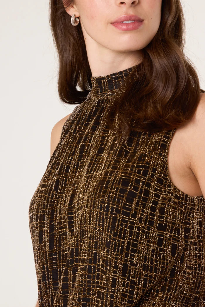 A woman wearing a sleeveless high-neck Lurex top featuring a black and gold geometric pattern, ideal for adding sparkle to any party outfit.