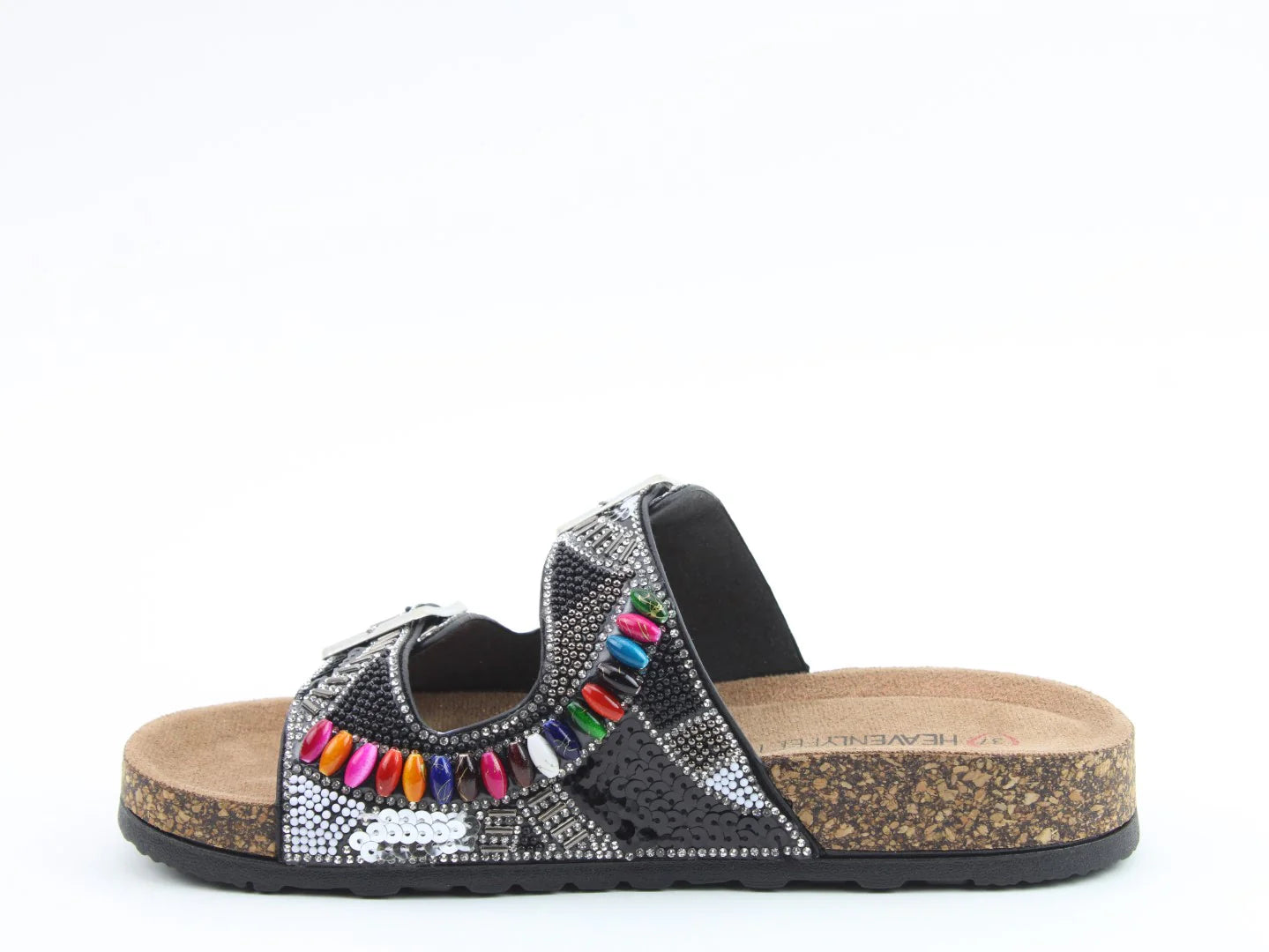 A black slide sandal with a cork sole and contoured footbed, featuring silver patterns and colourful bead decorations on the strap, crafted from vegan-friendly materials, shown in a side profile view.
