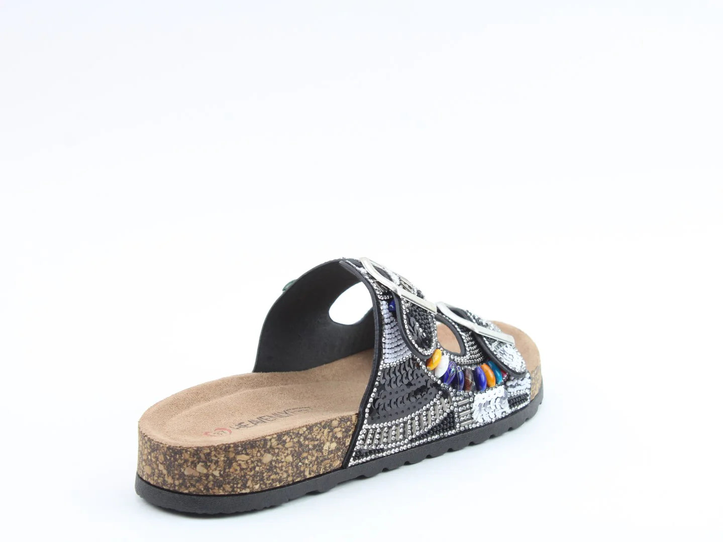 A single black and silver patterned slide sandal with a contoured footbed, cork sole, and colourful bead accents, crafted from vegan-friendly materials and displayed against a white background.