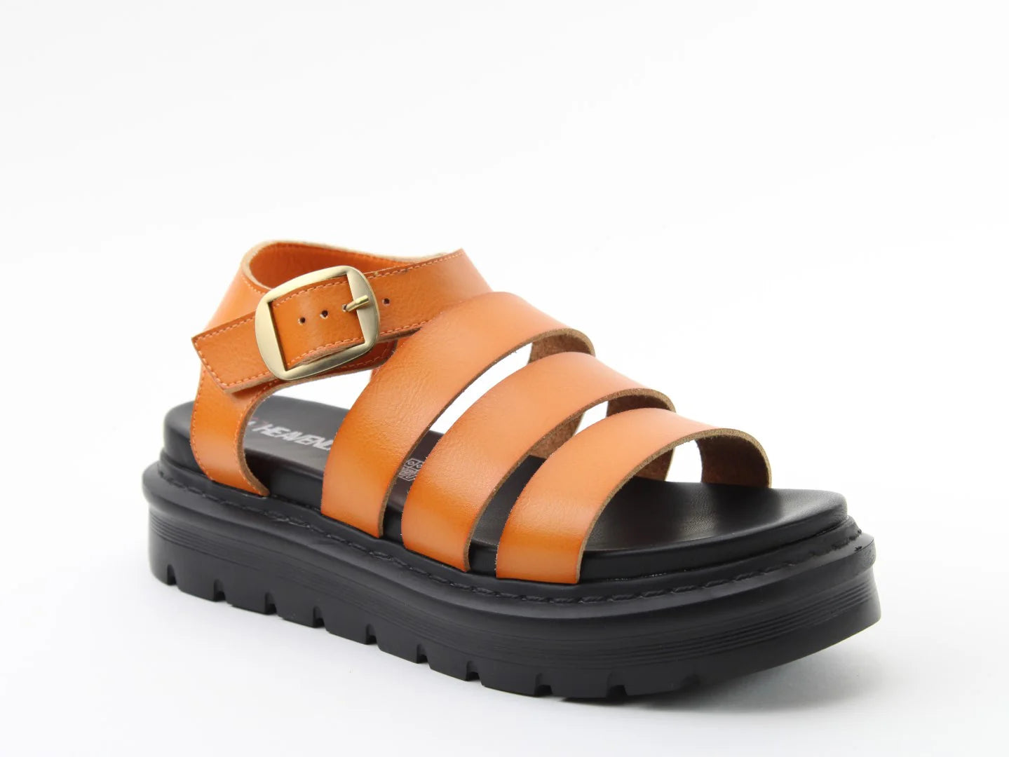 Orange strappy vegan sandal with a thick black sole, gold buckle, and three toe straps—perfect lightweight sandals for summer, photographed against a plain white background.