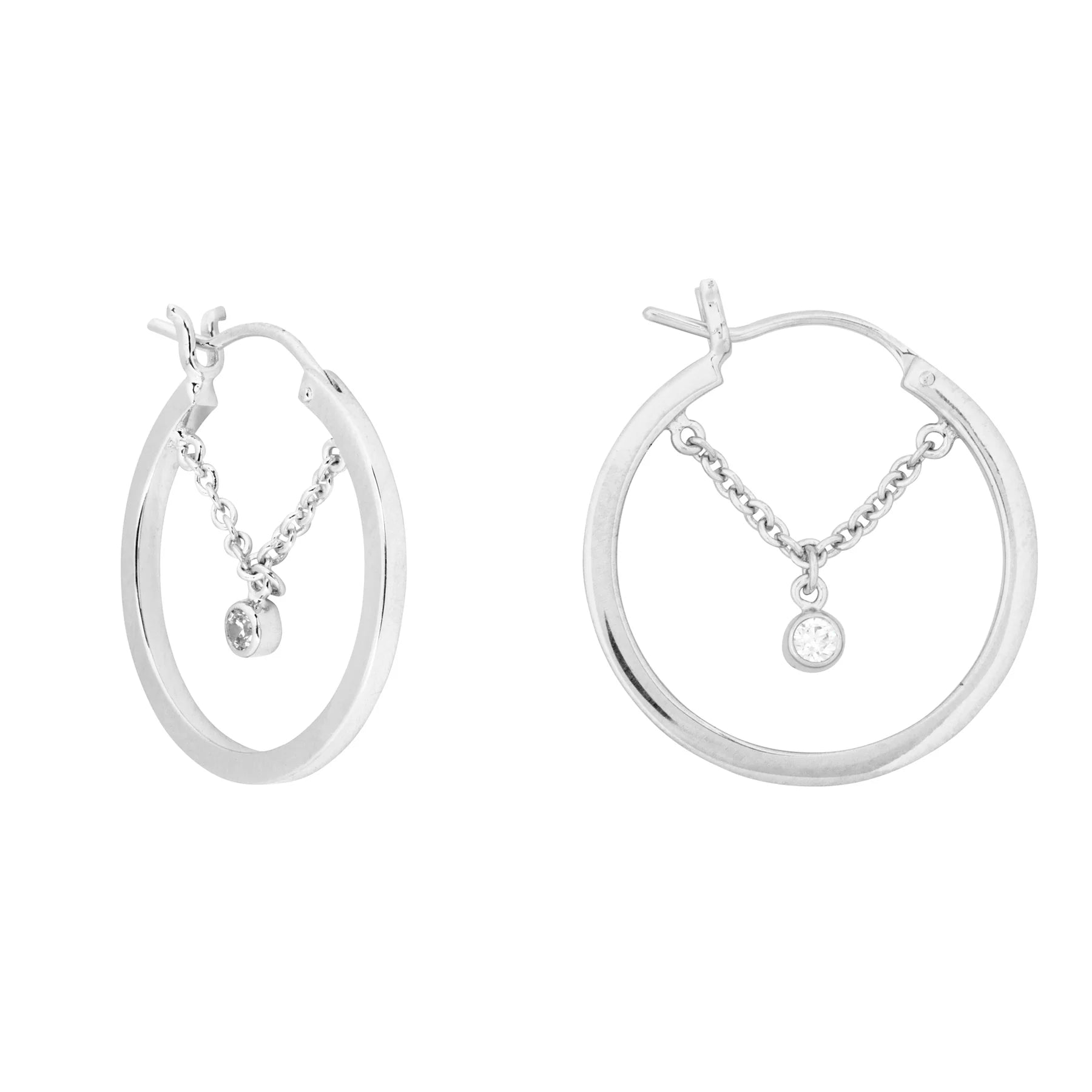 Pair of silver hoop earrings featuring a dangling chain and a single round crystal gem suspended in the centre of each hoop.