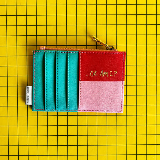 A compact purse with card slots and a zip, this clever gift displays “…OR AM I?” on a yellow, grid-patterned background—ideal for anyone prone to overthinking.