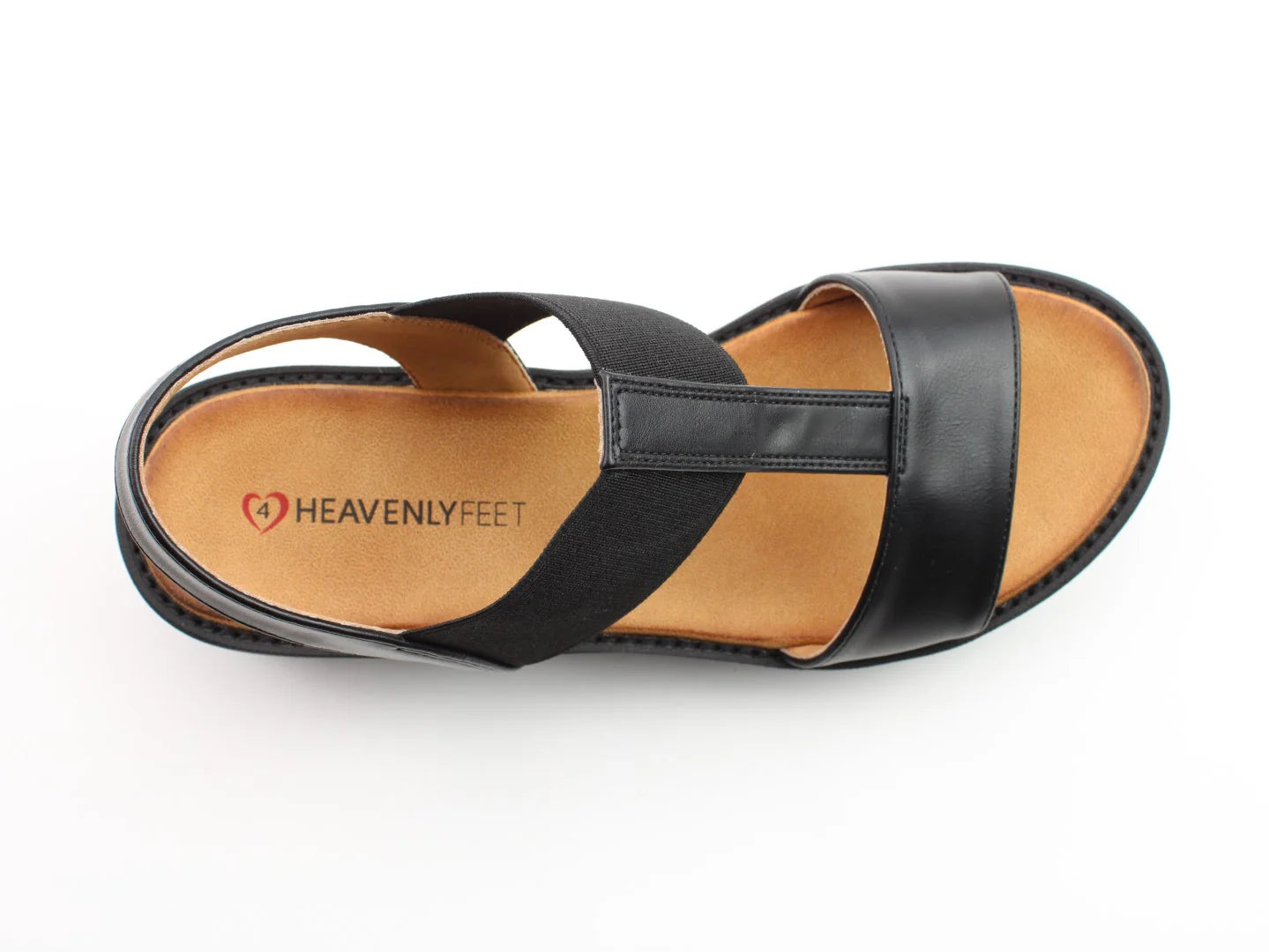Discover the Ritz Casual Sandals: black sandals with an elastic strap, vegan-friendly materials, a cushioned footbed, and a tan insole featuring the Heavenly Feet logo.
