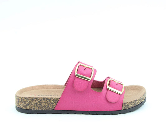 The Harmony2 Sandal is a pink slip-on with two adjustable straps and gold buckles. This vegan-friendly sandal features a cork sole with a textured black base, combining style and sustainability.