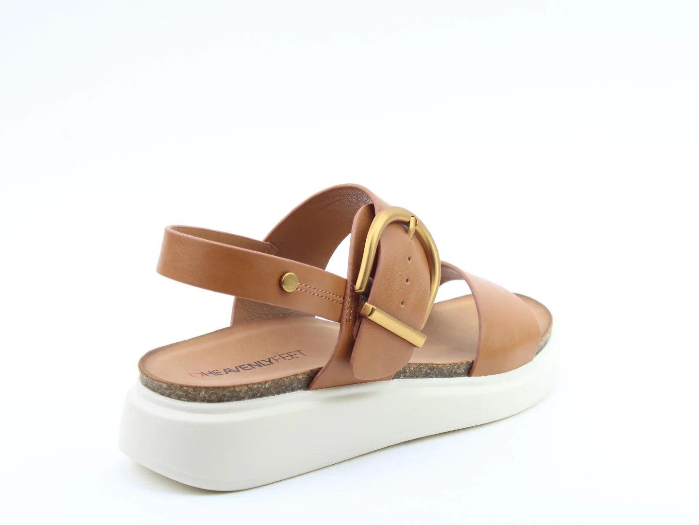 Brown BERNIE TAN Sandals featuring a large gold buckle and a white platform sole, perfect for a chic summer look, viewed from the side against a plain background.