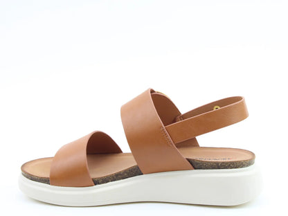 Side view of BERNIE TAN Sandals in brown leather with two straps and a slingback, featuring a white platform sole. Perfect for a chic summer look.