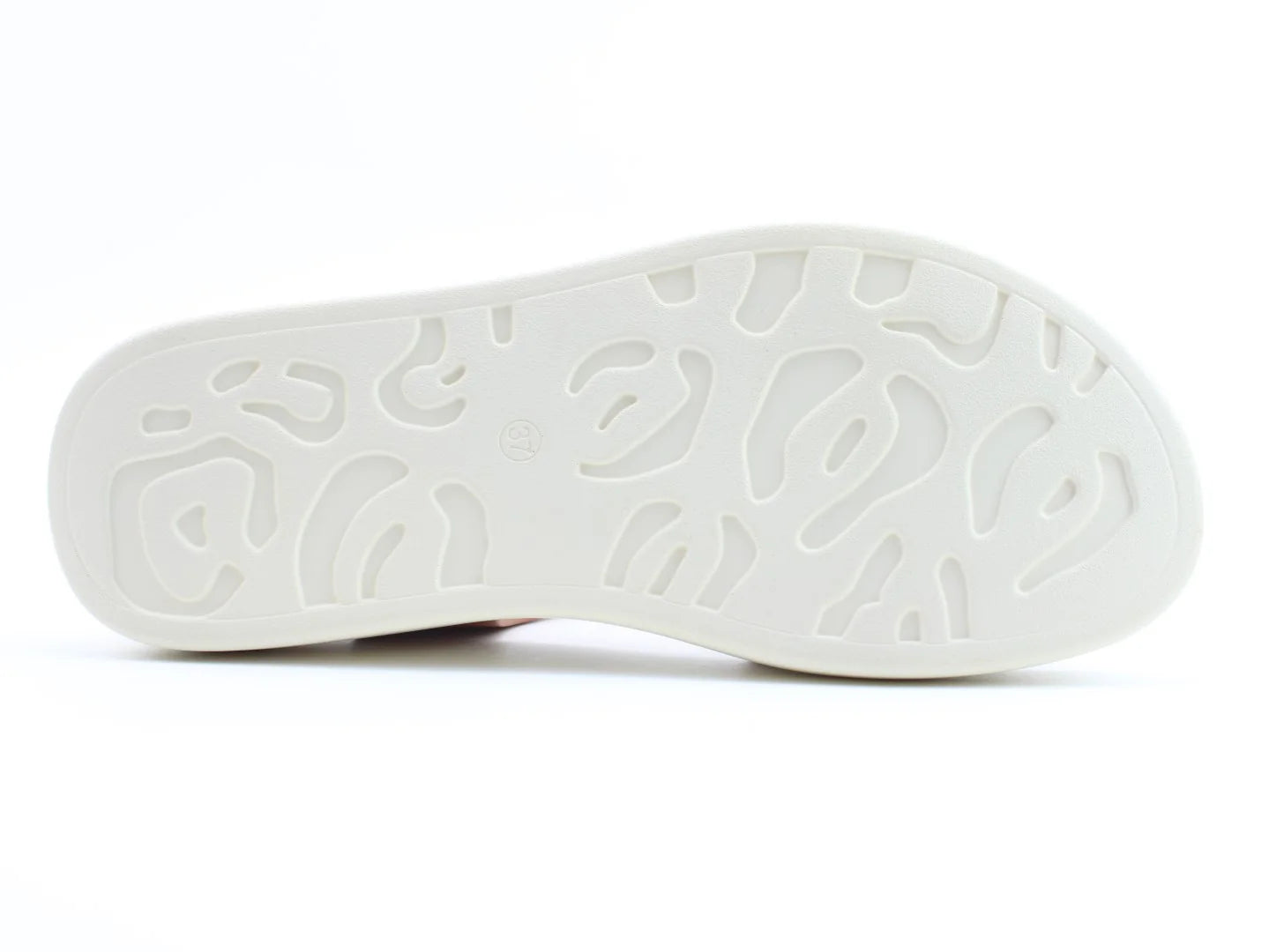The image showcases the underside of a white sole with a textured, wavy pattern, perfectly complementing a summer look.