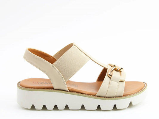 The Lulu2 Sandals boast a beige open-toe design with wide straps and a decorative metallic buckle, resting on a chunky white platform Litesoles outsole with zigzag tread. Whats more, theyre vegan-friendly!.