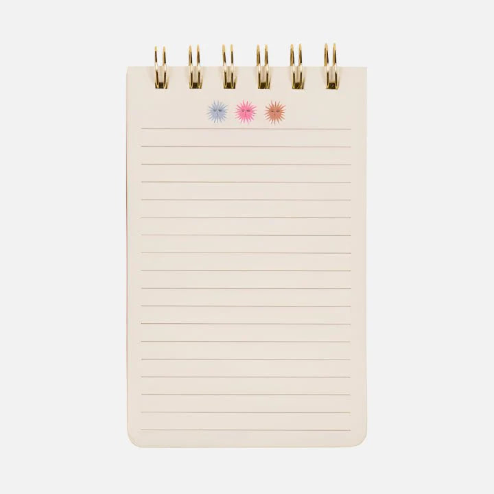 A small spiral-bound Sun Flip Notebook with lined pages and three starburst designs in blue, pink, and orange at the top—ideal for bringing a splash of cheerful stationery to your day.
