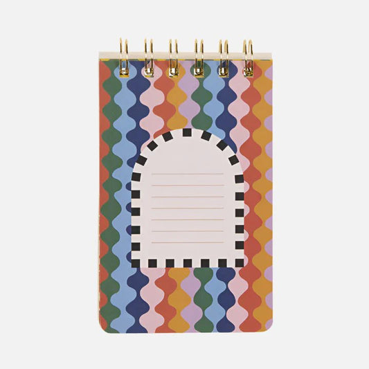 A small spiral Sun Flip Notebook with a colourful wavy pattern and a central label for writing, featuring a black-and-white arched border—ideal for fans of cheerful stationery.