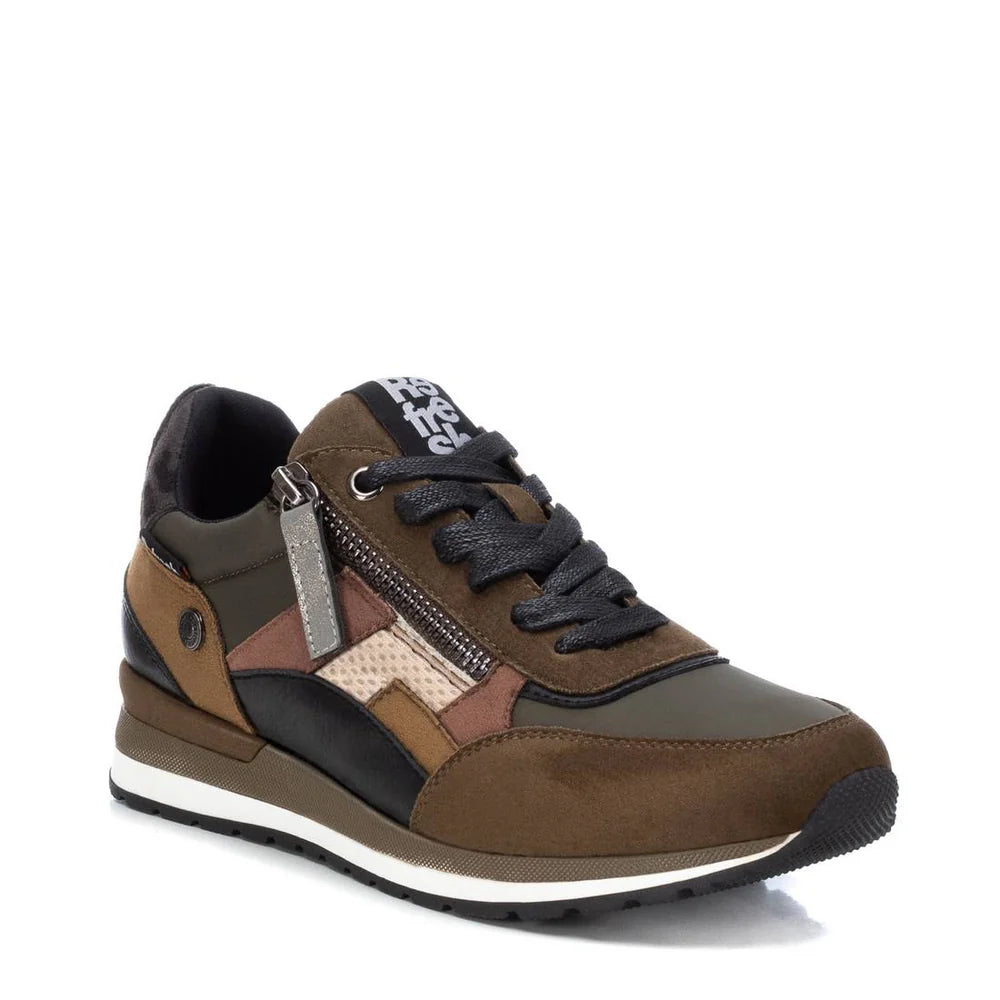 A brown and olive green women’s vegan trainer featuring black laces, a side zip, removable insole, white sole, and black detailing, shown on a white background. Made from PETA-certified vegan materials.