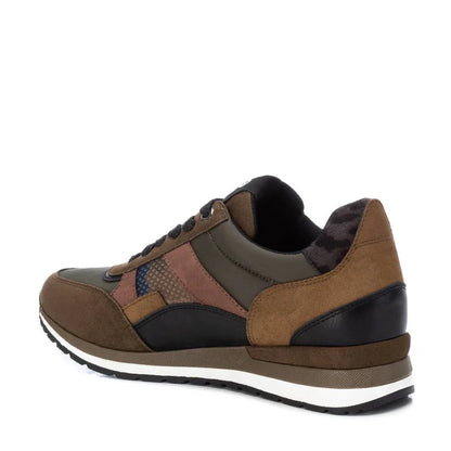 A brown, green, and black women’s vegan trainer with suede-effect and leather panels, mesh detailing, a removable insole, white-striped sole, and lace-up fastening—shown from the side and slightly behind.