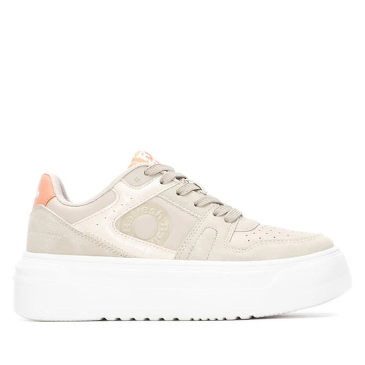 A beige trainer with a chunky white sole, light pink accents on the heel and tongue, and the brand logo embossed on the side. Includes a removable insole for extra comfort.