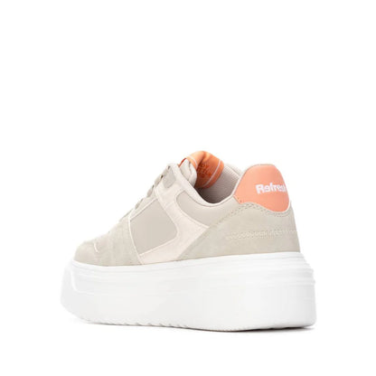 A beige and white platform vegan trainer with an orange heel accent, removable insole, and the brand name Refresh on the back.